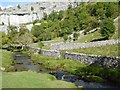 SD8963 : Malham Beck and Malham Cove beyond by David Smith