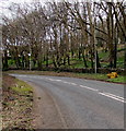 SS8478 : Yellow grit bin at a bend in Bridgend Road, Porthcawl by Jaggery