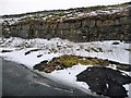 NY8712 : Exposed rock face, on the north side of the former A66 by Christine Johnstone