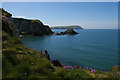 SN0439 : Cat Rock and cliffs from Carreg Germain by Christopher Hilton