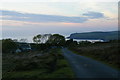 SN0437 : Looking down Ffordd Bedd Morus towards Newport / Trefdraeth, sunset by Christopher Hilton