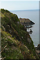 SN0439 : Cliffs and a view out to Cat Rock by Christopher Hilton