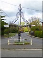 TM2652 : Village pump and signpost by Oliver Dixon