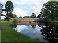 SJ9921 : Lake by the stable block in Shugborough Park by Graham Hogg