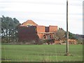 NZ2181 : Derelict shed in an arable field by Graham Robson