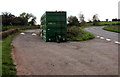 SO3617 : Dark green trailer and a speed bump in a layby near Llanvetherine by Jaggery