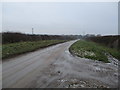 TA0773 : An  ice  covered  Mill  Road  toward  Burton  Fleming by Martin Dawes