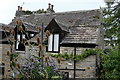 NZ0415 : Stone tiles and Dormer windows by Bob Harvey