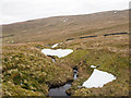 NY6344 : Snow patches along course of Longtongue Beck by Trevor Littlewood