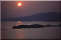 NM4334 : Setting sun over Inch Kenneth and Ulva by Ian Taylor