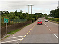 W8473 : Telegraph Wires crossing the N25 near Midleton by David Dixon