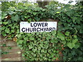 TM1134 : Lower Churchyard sign by Geographer