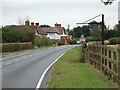 TL9326 : Entering Eight Ash Green on the A1124 Halstead Road by Geographer