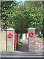 SP9211 : Poppy Wreaths at the side gate of Tring Church for Armistice Day by Chris Reynolds