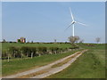 NZ3930 : Track and wind turbine near Sedgefield by Malc McDonald