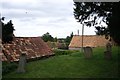 SK9818 : Pantile  roofs near the church by Bob Harvey