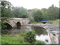 NT0667 : Howden Bridge and weir, Livingston by M J Richardson