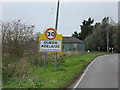 TL5781 : Queen Adelaide Village Name sign by Geographer