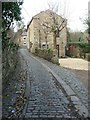 NY7164 : "One of the three remaining cobbled streets in the town" by Christine Johnstone