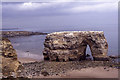 NZ4064 : Marsden Rock in 1990 before arch collapse by Colin Park