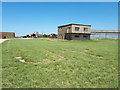 SP1812 : Control tower, former RAF Windrush with UR marked in grass by Vieve Forward