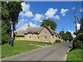 SP3724 : Pub sign and thatched cottage, Enstone by Malc McDonald