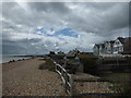 TQ6503 : Gardens on the beach at Pevensey Bay by Marathon