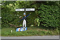 TM2551 : Surfing scarecrow on the roadside at Hasketon by Simon Mortimer