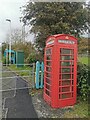 SH5727 : K6 Telephone Kiosk outside Pensarn Station by PAUL FARMER