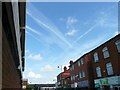 SJ9594 : Contrails over Clarendon Place by Gerald England