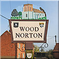 TG0127 : Wood Norton village sign by Adrian S Pye