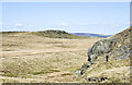 NY9417 : Rock outcrop at opening to Catty Quarry by Trevor Littlewood