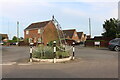 TL4889 : Traffic island garden on High Street, Manea by David Howard