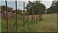 NS9964 : Derelict Kennels near Grove Mount by Ian Dodds