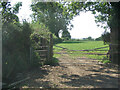 SS8779 : Two gates and a farm field just south of Laleston by eswales