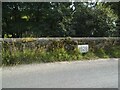 SD7586 : Datestone in the river wall opposite Hud's House by Stephen Craven