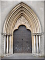 ST5773 : Ornate door on the south of Christ Church by Neil Owen