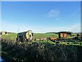 NZ1259 : Farm machinery at Horsegate by Robert Graham