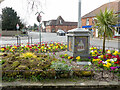 TG2830 : Millennium Flower bed around town sign by David Pashley