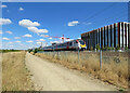 TL4554 : A train passing Cambridge Biomedical Campus by John Sutton