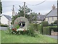 NT9941 : Millstone and sign, Bowsden Hall Farm by Richard Webb