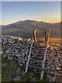 SH5552 : Stile on Y Garn (Nantlle Ridge) with Y Wyddfa in the background by Ben Meyrick