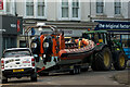 SS5147 : A John Deere tractor towing a Humber seafari rib boat with two Suzuki 625 outboard motors through Ilfracombe by Roger A Smith