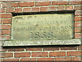 TA1552 : Stone  plaque  on  derelict   chapel  front  Dunnington by Martin Dawes