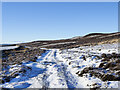 NZ0238 : Hill road on south side of Fatherley Hill by Trevor Littlewood