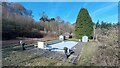 NO2227 : Swimming Pool, Tennis Court and Thatched Hut by Mick Garratt