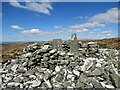 NX9099 : Trig pillar and summit shelter, Bellybought Hill by Alan O'Dowd