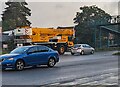 ST3091 : Yellow mobile crane in transit, Malpas, Newport by Jaggery