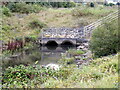 SH8076 : Drainage pipes through a culvert into the Afon Conwy by Richard Hoare