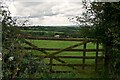 SS5222 : A wooden five bar gate on a road between Huntshaw Cross & Huntshaw Moor Cross by Roger A Smith